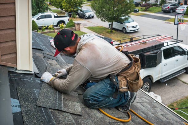 Professional Emergency Roof Repair technician working in Montezuma, IA